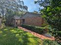 Brick facade and walkway leading to the entrance of the home at 1507 Water Oak Way S, Bradenton, FL 34209