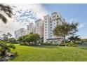Luxury condo building with manicured lawn and parking at 2925 Terra Ceia Bay Blvd # 2203, Palmetto, FL 34221