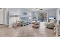 Relaxing living room with light tile floors and comfortable seating at 3704 6Th Ave # 5, Holmes Beach, FL 34217