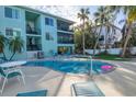 Inviting swimming pool area with lounge chairs, creating a relaxing resort-like atmosphere at 3704 6Th Ave # 5, Holmes Beach, FL 34217
