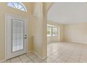 Bright entryway with tile flooring and views into the living room at 3915 Fonsica Ave, North Port, FL 34286
