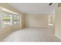 Spacious living room featuring tile flooring and large windows at 3915 Fonsica Ave, North Port, FL 34286