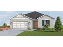 Gray one-story house with a two-car garage and landscaping at 4519 Boxelder Avenue, Parrish, FL 34219
