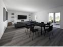 Open concept living and dining area with dark hardwood floors at 4523 Boxelder Avenue, Parrish, FL 34219