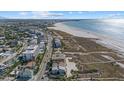 Aerial view of beach house with ocean view, located close to other beach homes at 600/602 Beach Rd # 1 & 2, Sarasota, FL 34242