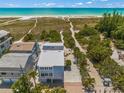 Aerial view of beach house with ocean views and walkway to beach at 600/602 Beach Rd # 1 & 2, Sarasota, FL 34242