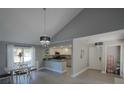 Open concept kitchen and dining area with modern finishes at 6262 142Nd N Ave # 805, Clearwater, FL 33760