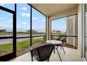 Relaxing screened lanai overlooking a serene lake at 7911 Grand Estuary Trl # 106, Bradenton, FL 34212