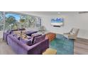 Spacious living area featuring a comfortable sectional sofa and large windows at 100 Sands Point Rd # 323, Longboat Key, FL 34228