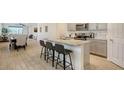 Modern kitchen with an island and stainless steel appliances at 204 Villoresi Blvd, Nokomis, FL 34275