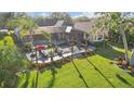 Aerial view showcasing a large backyard oasis with a pool and patio at 2305 Little Country Rd, Parrish, FL 34219