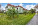 Building exterior with palm trees and walkway at 3500 Beneva Rd # 303, Sarasota, FL 34232
