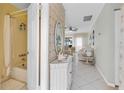 Clean condo bathroom with shower/tub combo and vanity at 6238 7Th W Ave # 6238, Bradenton, FL 34209