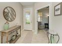 Bright and airy entryway with a view into a cozy den at 6739 Haverhill Ct, Lakewood Ranch, FL 34202