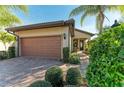 Single-story home with attached garage and well-manicured landscaping at 6739 Haverhill Ct, Lakewood Ranch, FL 34202