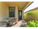 Inviting front patio with seating area and lush greenery at 6739 Haverhill Ct, Lakewood Ranch, FL 34202