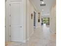 Bright hallway with tile floors and access to other rooms at 9765 Highland Park Pl, Palmetto, FL 34221