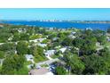 Aerial perspective of a residential area, highlighting a single-story house and neighborhood context at 104 24Th Ne St, Bradenton, FL 34208