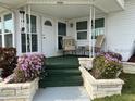 Covered porch with seating and potted plants at 1111 42Nd E Ave, Ellenton, FL 34222