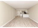 Spacious living room with light walls and wood-look flooring at 129 Tyler Dr # 101, Sarasota, FL 34236