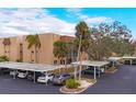 Aerial view showing condo building and parking at 1330 Glen Oaks E Dr # 268D, Sarasota, FL 34232