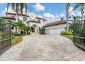 Grand estate home with gated entry and expansive driveway at 1389 Tangier Way, Sarasota, FL 34239