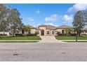 Single-Gathering house with a driveway and well maintained lawn at 17109 1St E Dr, Bradenton, FL 34212