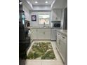 Modern kitchen with granite countertops and stainless steel appliances at 2220 Stickney Point Rd # 537, Sarasota, FL 34231