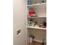 Well-organized laundry closet with shelving at 2753 Orchid Oaks Dr # 104, Sarasota, FL 34239