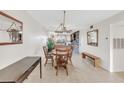 Bright dining area with a rustic wooden table and bench at 3751 Lake Bayshore Dr # H304, Bradenton, FL 34205