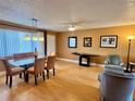 Bright dining area with glass table and seating for six at 4210 Ironwood Cir # 308J, Bradenton, FL 34209