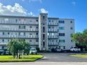 Exterior view of a condo building with parking and landscaping at 4210 Ironwood Cir # 308J, Bradenton, FL 34209