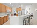 Kitchen with breakfast bar and ample counter space at 5351 Laurel Oak Ct, North Port, FL 34287
