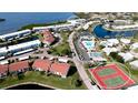 Aerial view of community, highlighting pool and tennis courts at 4726 Independence Dr # 4726, Bradenton, FL 34210