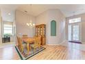 Dining room with hardwood floors and wooden table set at 6710 Pebble Beach Way, Lakewood Ranch, FL 34202