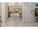 Spacious entry hall with views into the living and dining areas at 7363 Silver Fern Blvd # 80, Sarasota, FL 34241