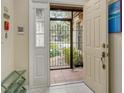 Bright entryway with tiled floors and access to a private courtyard at 7363 Silver Fern Blvd # 80, Sarasota, FL 34241