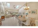 Open living area with high ceilings, skylights, and a grand piano at 7363 Silver Fern Blvd # 80, Sarasota, FL 34241