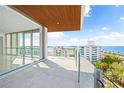 Spacious balcony with water views and city skyline at 111 Golden Gate Pt # 701Ph, Sarasota, FL 34236