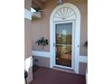 Attractive front entry with arched top and glass door at 114 Wilmers Rd, Punta Gorda, FL 33982