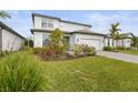 Landscaped front yard with lush green grass and plants at 12409 Wigeon Dr, Bradenton, FL 34212