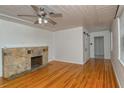 Living room featuring hardwood floors and fireplace at 1320 Cocoanut Ave, Sarasota, FL 34236