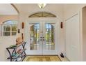 Bright entryway with double doors and decorative accents at 1572 Nimbus Dr, North Port, FL 34287