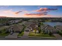 Community view showing the home's location near a lake at 2028 Woodleaf Hammock Ct, Bradenton, FL 34211