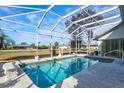 Relaxing screened-in pool area with a spacious deck at 2053 Rio De Janeiro Ave, Punta Gorda, FL 33983