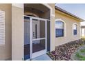 Front entrance with white door and screen at 22419 Bette Ave, Port Charlotte, FL 33954