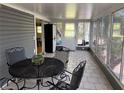 Enclosed Florida Room with tile floors and outdoor views at 2601 Gulf N Dr # S2, Bradenton Beach, FL 34217