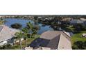 House with tile roof and screened enclosure near a lake at 3001 Seasons Blvd, Sarasota, FL 34240