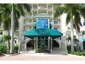 Condo building entrance with palm trees and stairs at 340 S Palm Ave # 45, Sarasota, FL 34236