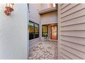 Brick paved entryway with a red door and exterior lighting at 3803 Wilshire W Cir # 37, Sarasota, FL 34238